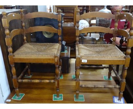 A pair of beech ladder-back and rush-seated corner chairs 