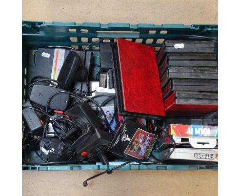 An Atari console and various games and equipment 