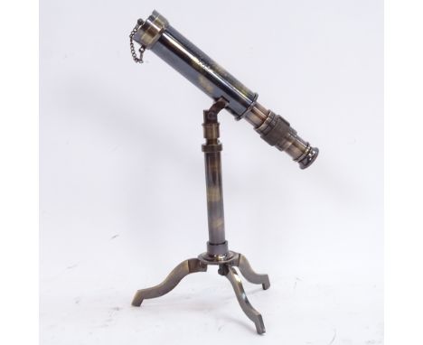 A modern brass table-top telescope, on folding tripod stand, engraved "W Ottway &amp; Co Ltd of Ealing London 1915", telescop