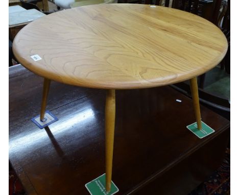 An Ercol light elm circular coffee table, on turned legs, W74cm, H45cm 
