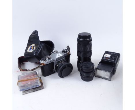 A Pentax K1000 camera, a Vivitar lens, and accessories in case 