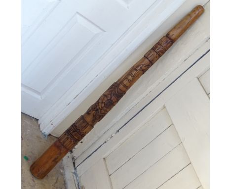 A modern Aboriginal style carved hardwood didgeridoo, length 130cm 