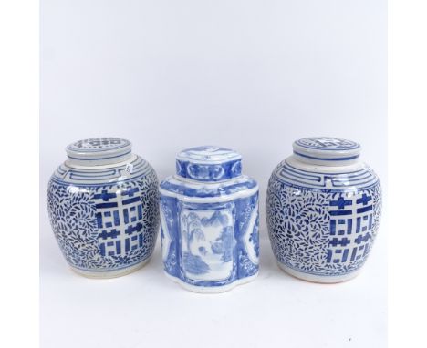 A pair of Chinese blue and white porcelain jars and covers, height 23cm, and one other ceramic jar (3) 