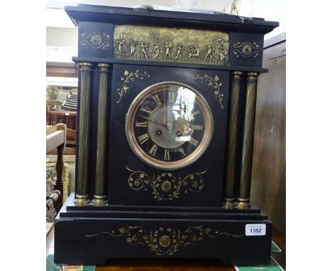 A Victorian black slate and gilded mantel clock, 8-day movement striking on a gong, with embossed brass panelled frieze and r