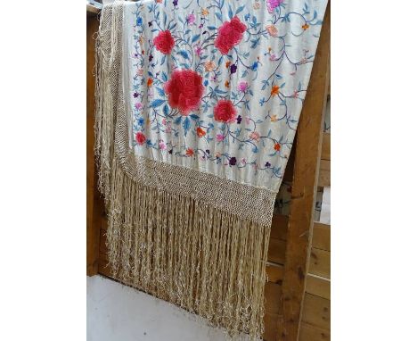 A Chinese silk embroidered shawl/table cover, with tasseled surround 