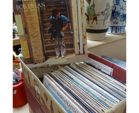 A box of Vintage LPs, including Moody Blues, Phil Collins, and Bob Dylan 