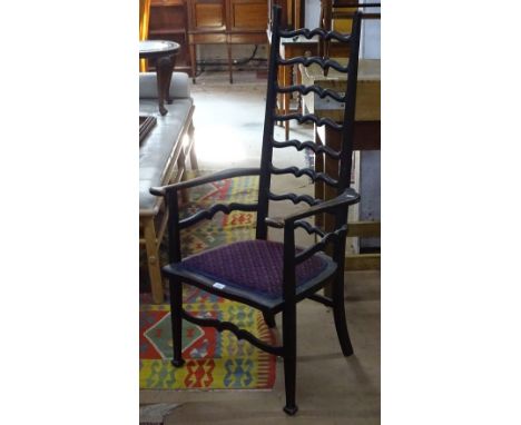A Liberty's style Art Nouveau wavey ladder-back armchair 