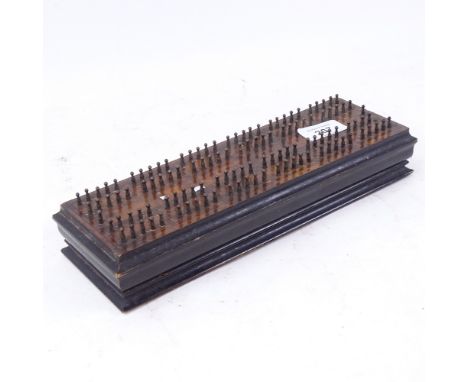 An Antique ebonised flame mahogany Cribbage board, length 28cm 