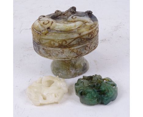 A Chinese relief carved jade box and cover, diameter 8cm, and 2 relief carved jade pendants (3) 