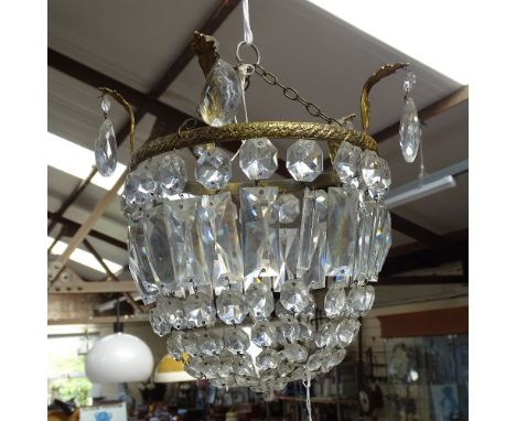A gilt-mounted light fitting with glass lustre drops 