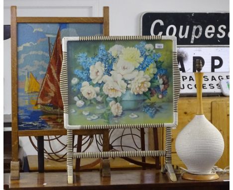 An oak-framed firescreen, a woven plastic-framed folding tray, and a table lamp 