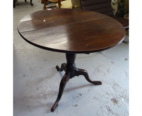 A Georgian oak tilt-top table on tripod base, W84cm 