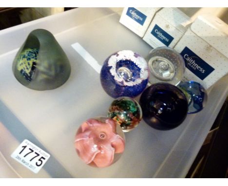 Four Caithness paperweights, Bristol blue brown glass ball, Avondale paperweight and a Mdina example 