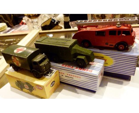 Three vintage Dinky vehicles 555 fire engine 677 armoured command car and 626 military ambulance in reproduction boxes