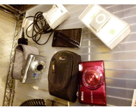 Two digital camera, an iPod touch and an iPod shuffle 