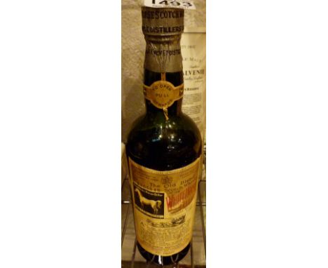 Bottle of White Horse Whisky from the 1940's   CONDITION REPORT:  Level has fallen by approximately 5 cms but bottle appears 