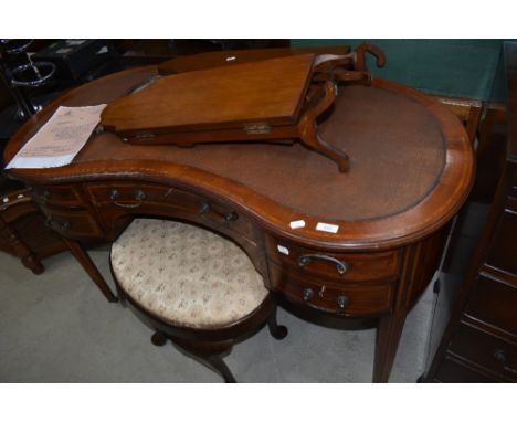 An early 20th Century mahogany and inlaid kidney shaped dressing table , stool and mirror (mirror in need of attention)
Appro