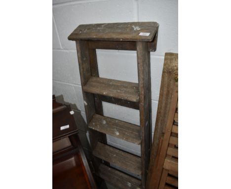 A set of vintage wooden step ladders
