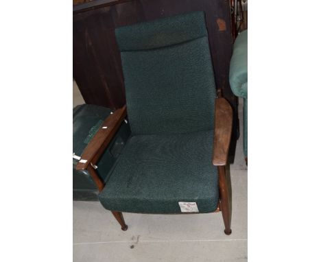 A vintage teak frame armchair upholstered in Harris Tweed