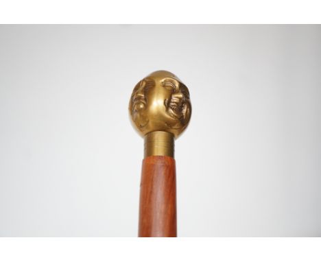 Brass 4 faced buddha handle walking stick 
