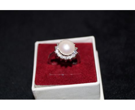 Silver dress ring with large simulated pearl