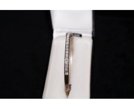 Silver bangle set with white stones 