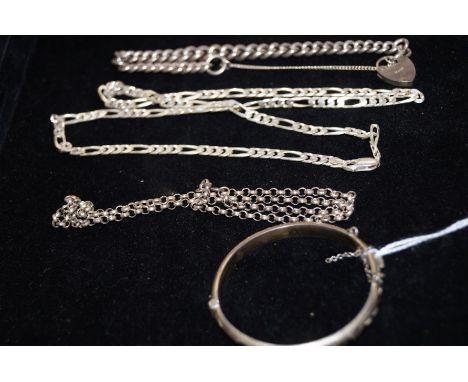 Collection of silver chains and a bangle. Total weight 69 grams