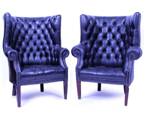 A NEAR PAIR OF BLACK LEATHER BUTTON UPHOLSTERED PORTER'S CHAIRS with studded borders and square tapering legs, each 88cm wide