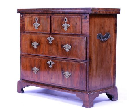 A 19TH CENTURY WALNUT CHEST OF TWO SHORT AND TWO LONG DRAWERS with a folding top and bracket feet, 76cm wide x 34cm deep x 69