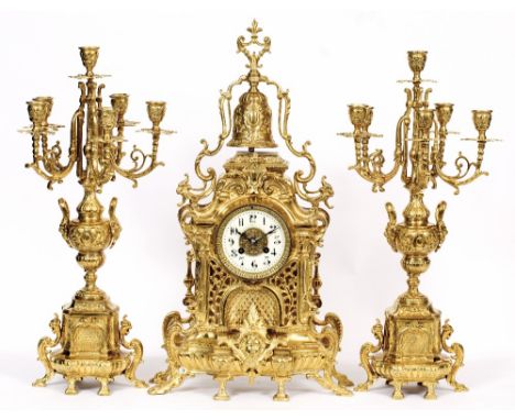 A VICTORIAN FRENCH LUPPENS GARNITURE CLOCK with white enamel dial and Arabic numerals, with elaborate rococo scrolling brass 