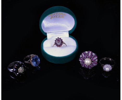 FIVE DRESS RINGS  to include a ruby and diamond cluster ring with cultured pearl inset to the centre, set in an 18 carat whit