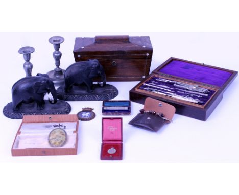 AN EARLY 20TH CENTURY ROSEWOOD CASED DRAWING INSTRUMENT SET a pair of carved ebony elephants, a pair of pewter candlesticks, 