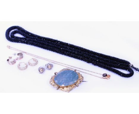 A COLLECTION OF JEWELLERY  comprising of a gem set pendant on chain, a Victorian hardstone panel brooch, an antique beaded ne