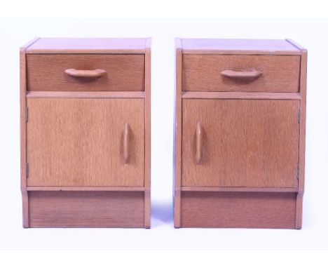A PAIR OF 1960'S LIGHT OAK BEDSIDE CUPBOARDS each 36cm wide x 31cm deep x 51cm high (2)