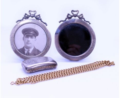 A PAIR OF ANTIQUE BIRMINGHAM SILVER CIRCULAR PHOTO FRAMES with bow top decoration, a gilt metal flat kerb chain and a Georgia