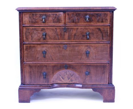 AN EARLY 18TH CENTURY WALNUT CHEST OF TWO SHORT AND THREE LONG GRADUATED DRAWERS each with brass drop handles, the lower draw