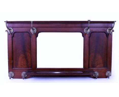 A VICTORIAN MAHOGANY HALL MIRROR with shaped bevelled edge mirror plate and later fitted brass hooks with a freestanding shel