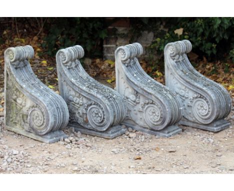A SET OF FOUR HADDONSTONE TYPE SCROLLING ARCHITECTURAL CORBELS each 41cm wide x 52cm high x 15.5cm deep (4)