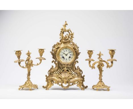 A FRENCH NEO-ROCOCO GILT BRASS CLOCK GARNITURE, 19th century, the twin barrel bell striking movement with outside count wheel