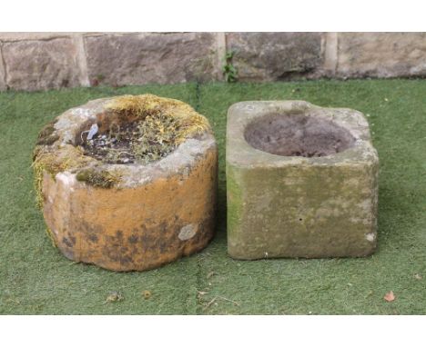 A SANDSTONE TROUGH of cylindrical form with flat rim, 18" x 11 1/2", together with another of rounded square form, 14 1/2" x 