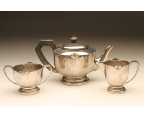 AN ART DECO SILVER THREE PIECE TEA SERVICE, maker's mark CB & Co., Birmingham 1945, of rounded cylindrical form with two cast