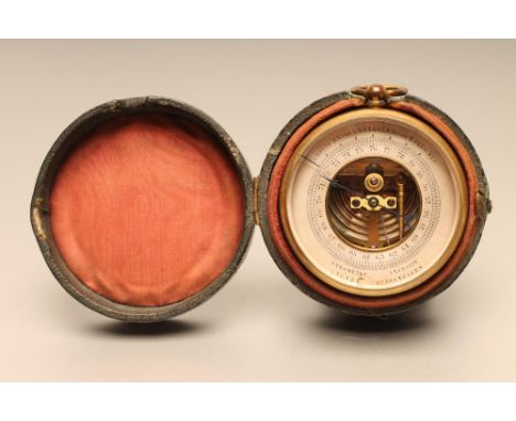 A FRENCH POCKET ANEROID BAROMETER, late 19th century, with open centre and silvered register, in gilded brass engine turned c
