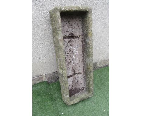 A SANDSTONE TROUGH of rough hewn oblong form, well cut, 44 1/2" x 16 1/2" x 9" (Est. plus 21% premium inc. VAT)