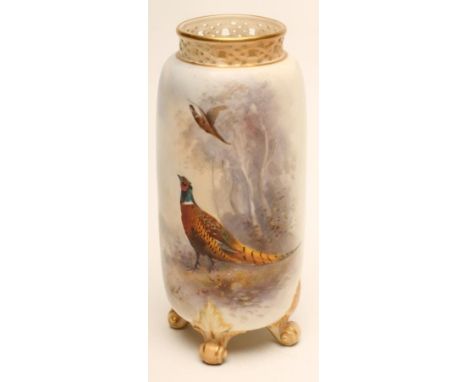 AN EDWARDIAN ROYAL WORCESTER CHINA VASE, 1905, of cylindrical form with scroll pierced neck raised upon four knurl feet, pain