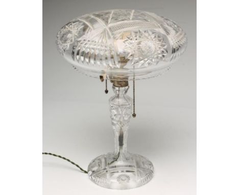 A GLASS ELECTRIC LAMP BASE, 1930's, the mushroom shade and inverted baluster stem and domed foot with slice, fan and star cut