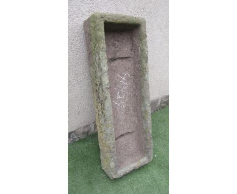 A SANDSTONE TROUGH of rough hewn oblong form, well cut, 46" x 16" x 9" (Est. plus 21% premium inc. VAT)