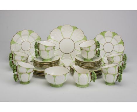 AN AYNSLEY CHINA "BUTTERFLY" TEA SERVICE, 1930's, with green highlighted moulded leaves, comprising twelve each cups, saucers