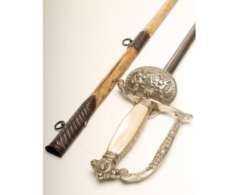 A DUTCH COURT SWORD, with 28 1/4" triangular section blade etched with armorials within foliate scrolls, hilt with shell guar