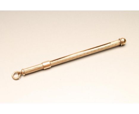 A 9CT GOLD PROPELLING SWIZZLE STICK of plain cylindrical form with engine turning and hanging loop, 4 3/4" long extended, 5g 