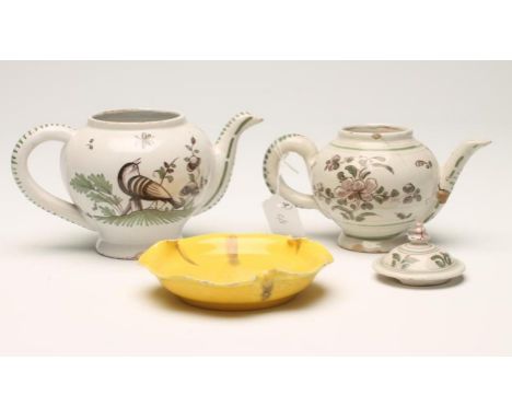 TWO FRENCH FAIENCE TEAPOTS, 19th century, both of globular form, one with a cover painted in manganese and green with stylise